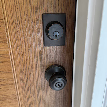 Matte-black double deadbolt installation by Defense Locksmith Buffalo NY