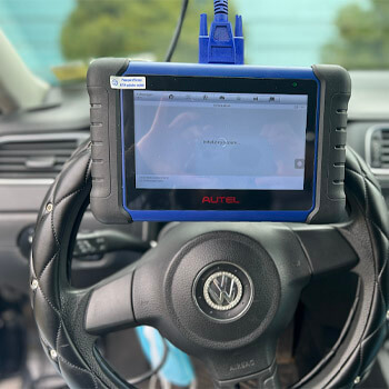 Vehicle Key Programming Buffalo NY Vehicle key programming with diagnostic tablet by Defense Locksmith Buffalo NY