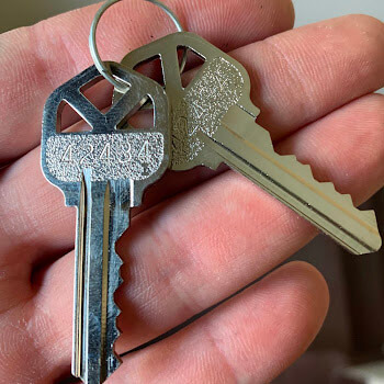 Cut house keys for residential rekey by Defense Locksmith Buffalo NY