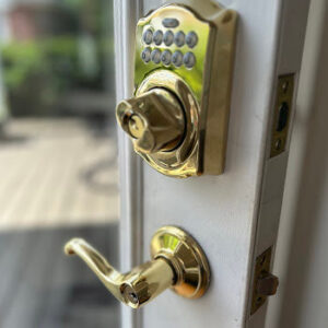 Decorative brass entry handleset installation by Defense Locksmith Buffalo NY