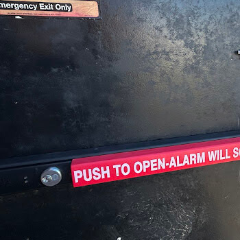 Emergency exit push bar with alarm installation by Defense Locksmith Buffalo NY