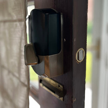 Surface-mounted electronic lock installation by Defense Locksmith Buffalo NY