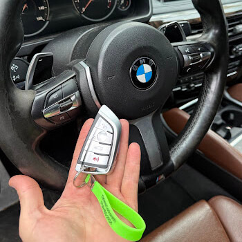 BMW key fob programming inside vehicle by Defense Locksmith Buffalo NY