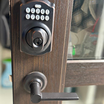 Commercial keypad deadbolt installation by Defense Locksmith Buffalo NY