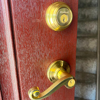 Deadbolt and Lockset Installation Buffalo NY Brass deadbolt and lever lockset installation on a Buffalo NY home