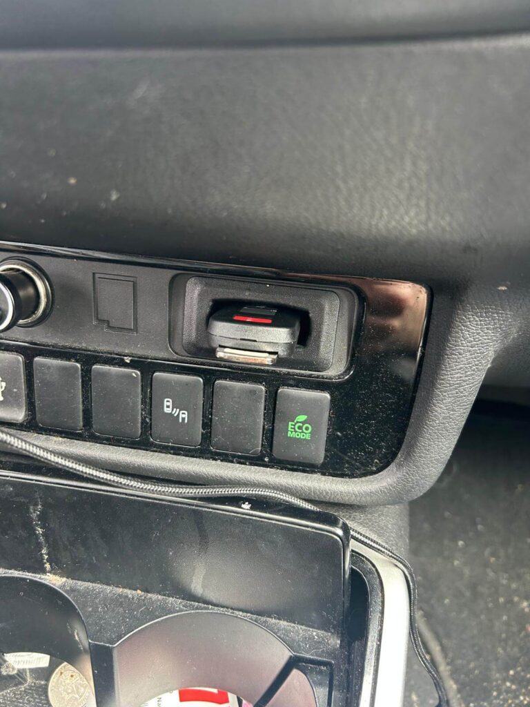 Car dashboard console lock serviced by an automotive locksmith in the Buffalo Metro area