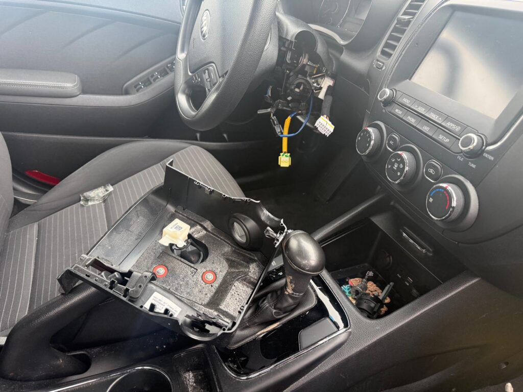 New car ignition key replacement being fitted inside a vehicle in the Buffalo Metro area