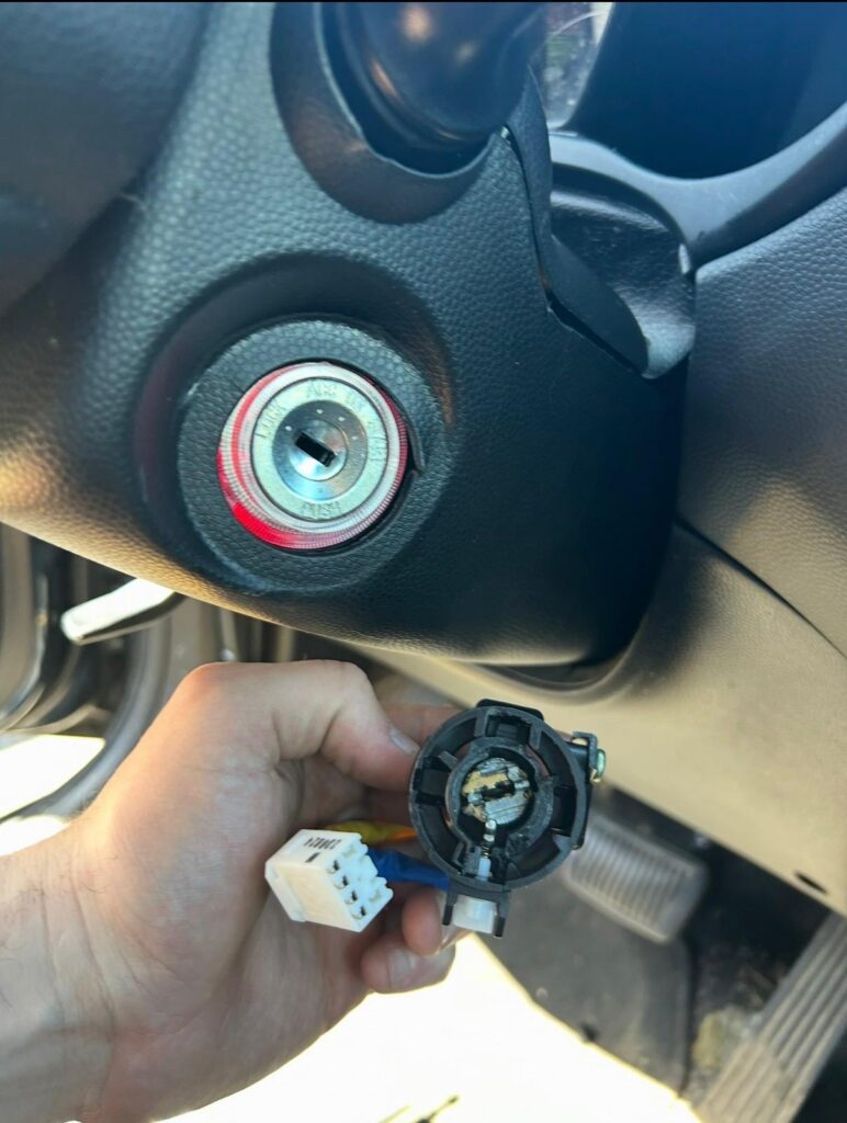 Car ignition switch repair with replacement part near the steering column in the Buffalo Metro area