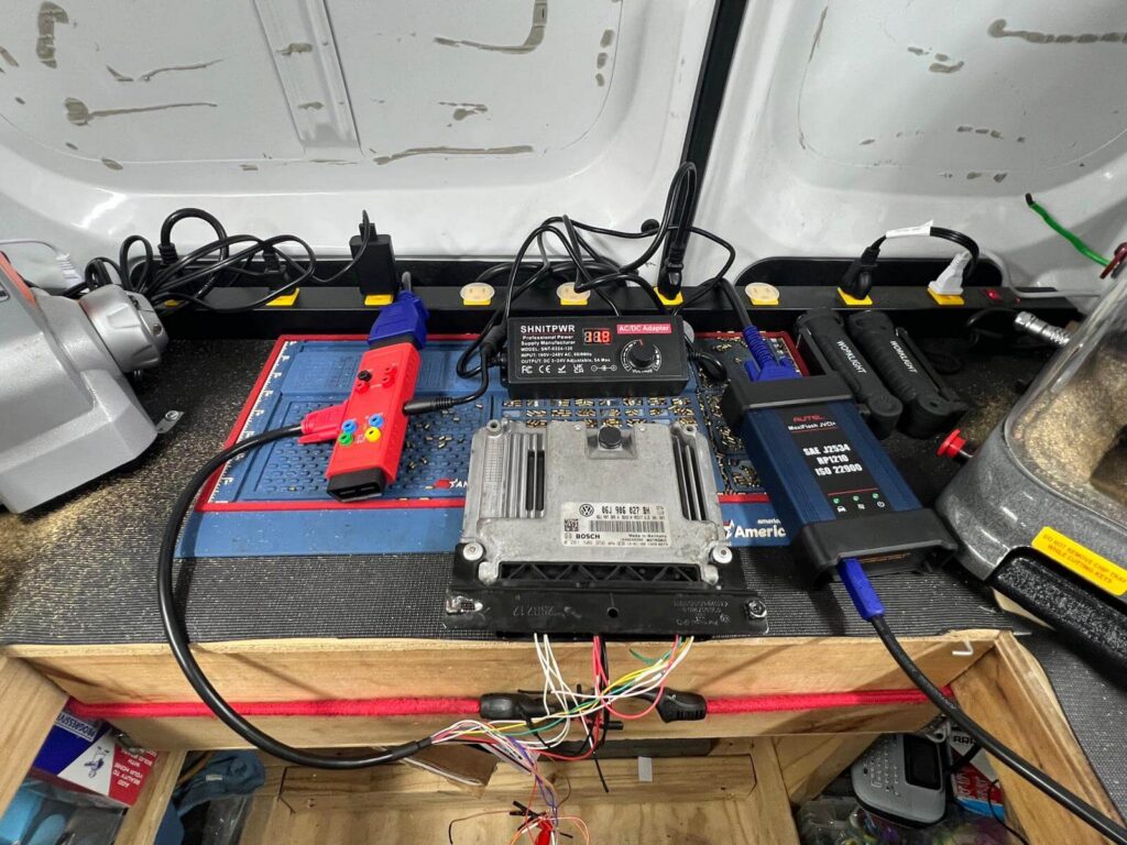 Car key ECU programming bench with diagnostic tools in the Buffalo Metro area