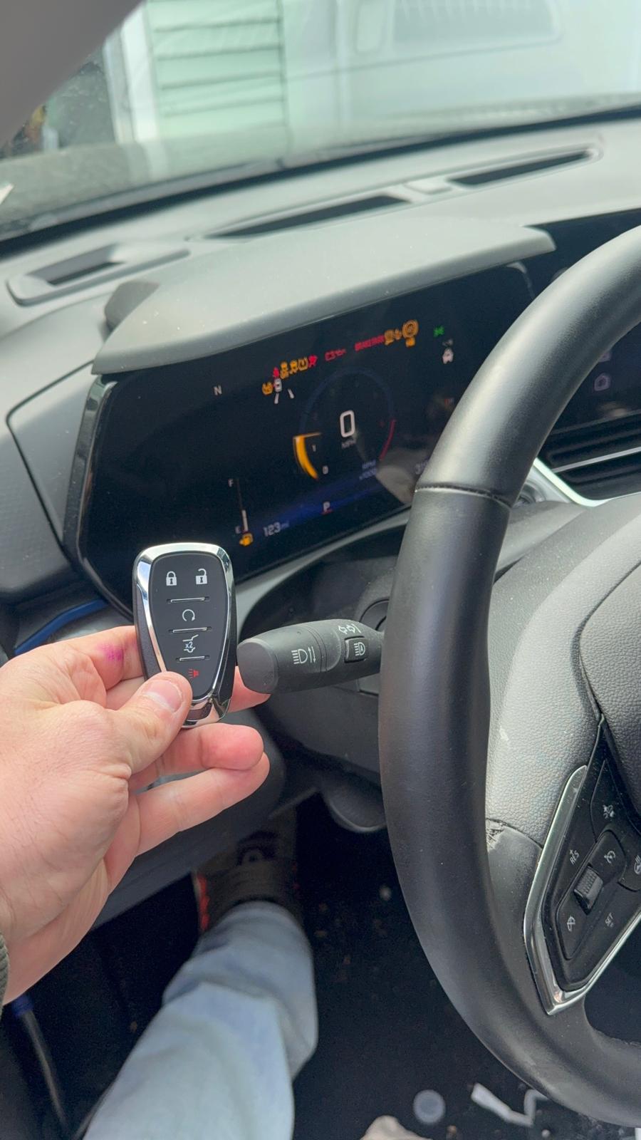 Car key fob replacement in Buffalo, NY A replacement smart key fob held inside a customer's vehicle in Buffalo, NY