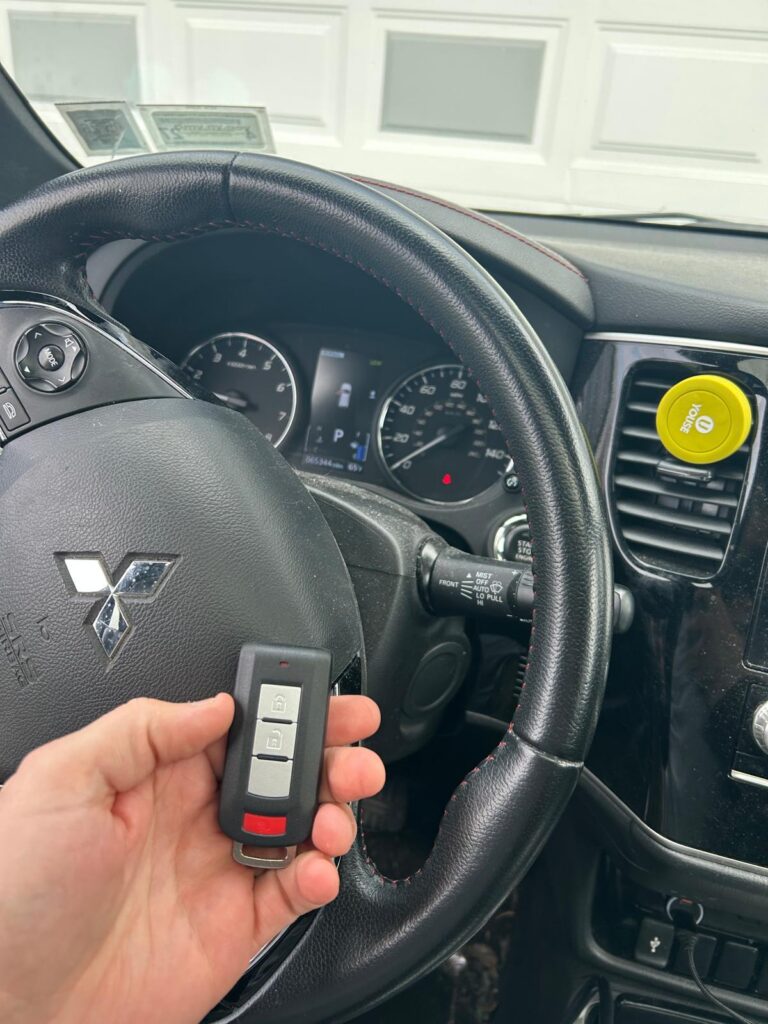 Freshly programmed replacement car key fob inside a vehicle in the Buffalo Metro area
