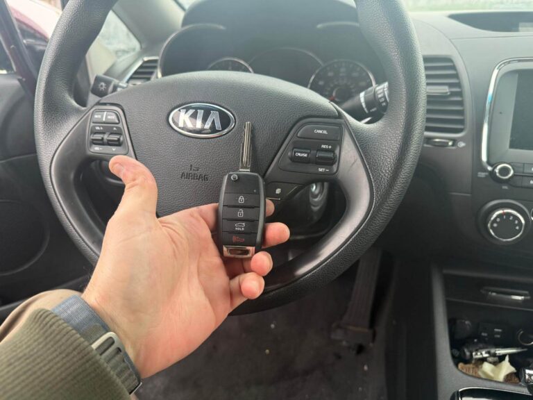 Kia replacement key fob held inside the vehicle in the Buffalo Metro area