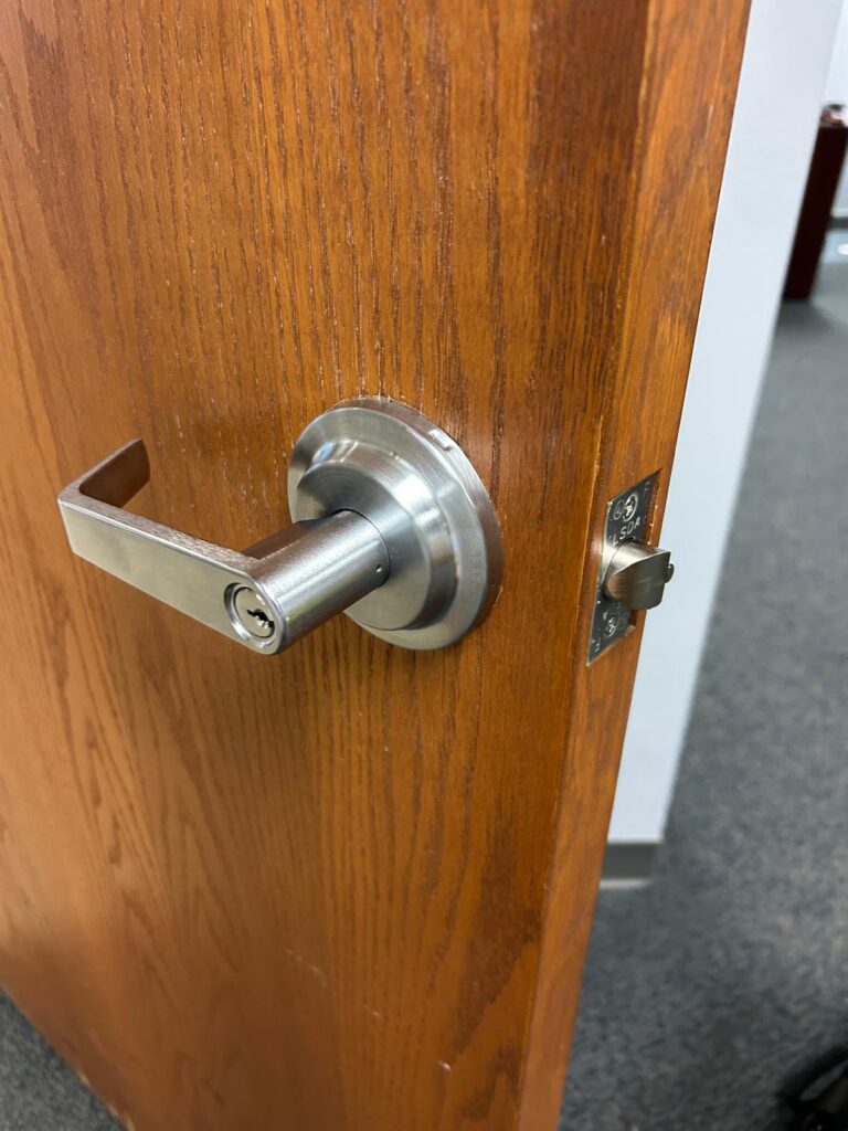 Commercial office door lever lockset with strike plate in Buffalo, NY