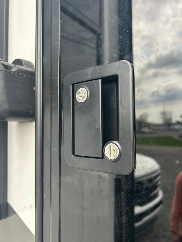 Commercial glass door lock on a storefront entry in the Buffalo Metro area