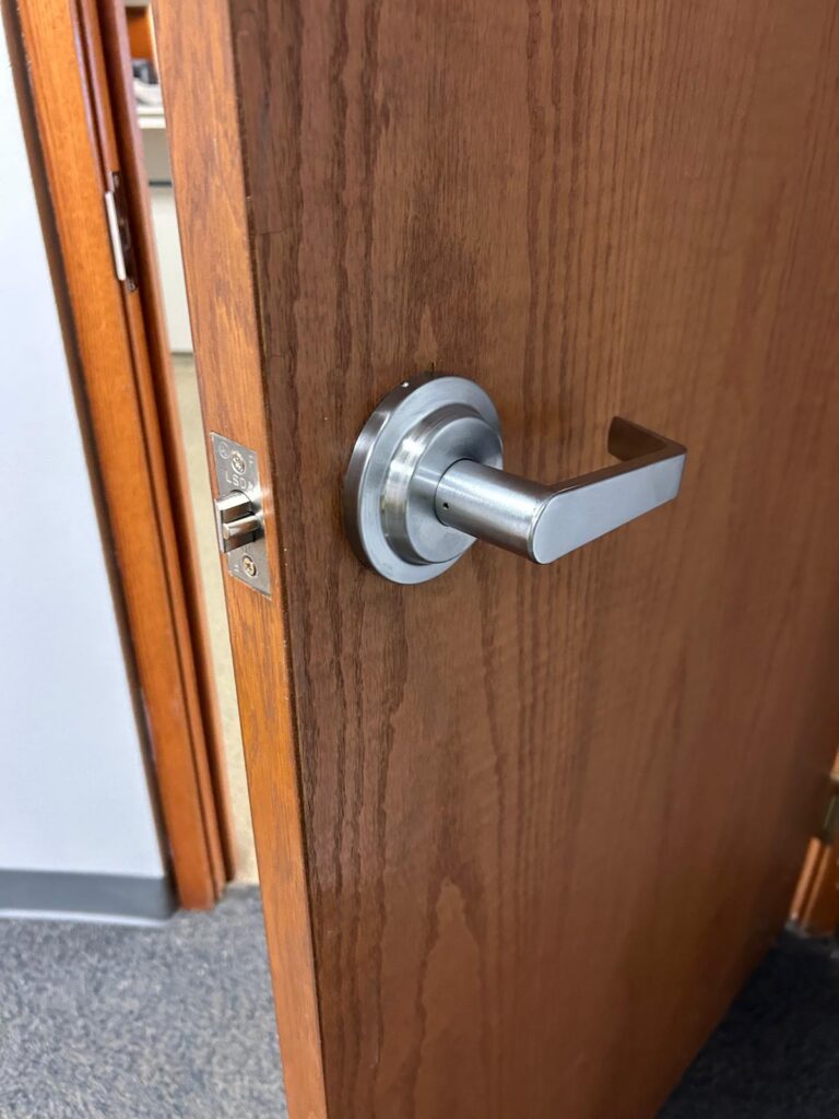 Commercial lever handle lockset on a wood office door in Buffalo, NY
