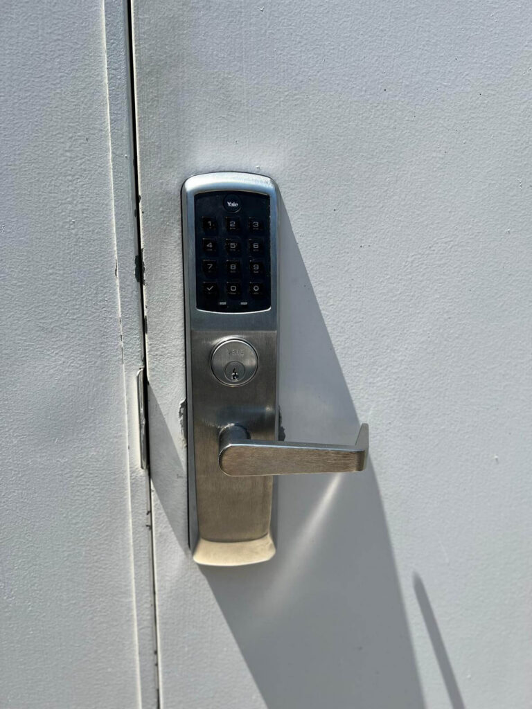 Electronic keypad lock with lever handle installed on a commercial door in Buffalo, NY