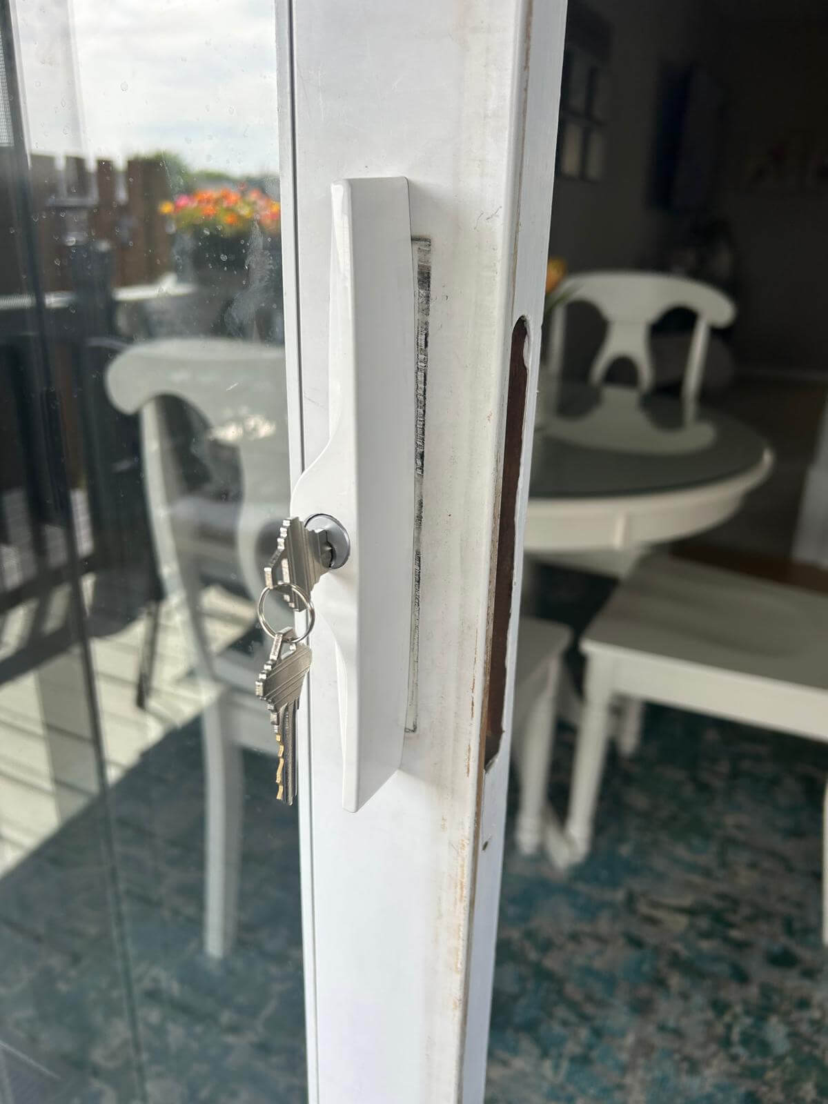 Patio door lock service in Buffalo, NY Keyed lock fitted to a sliding glass patio door in a Buffalo, NY home