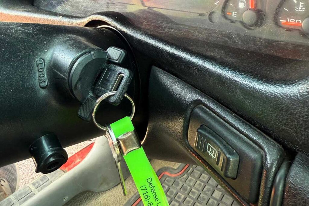 New green car key in the ignition in Buffalo, NY