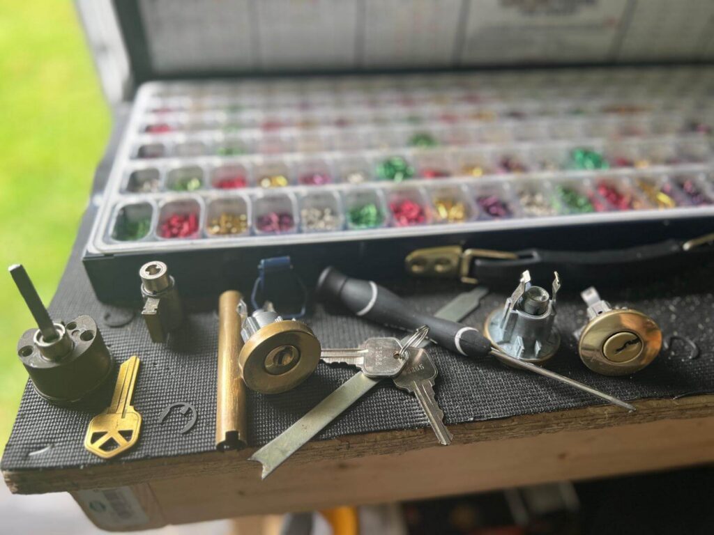 key duplication in Buffalo, NY - Defense Locksmith Cutting new keys to code on the machine - Defense Locksmith, Buffalo NY mobile locksmith (716) 803-2934
