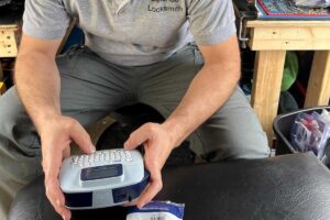 Locksmith programming a new key at the workbench