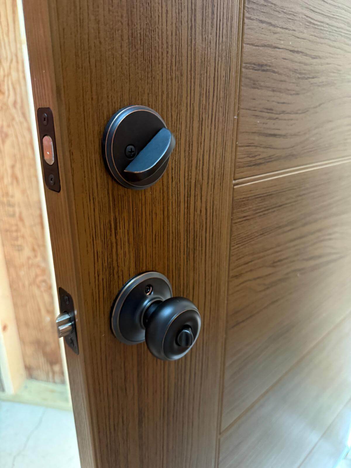 Rekeying a deadbolt on a Buffalo Metro home Deadbolt rekey service on a Buffalo, NY home