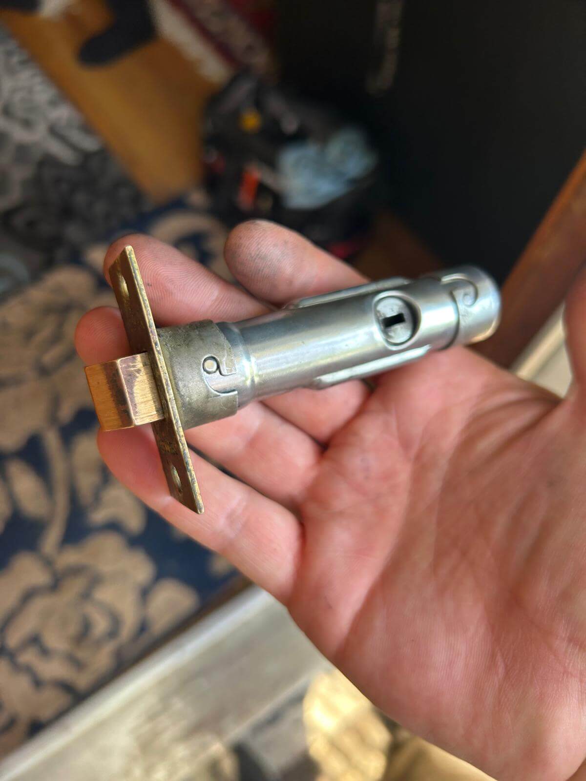 High-security lock cylinder service in Buffalo, NY Lock cylinder held by a locksmith during a high-security upgrade in Buffalo, NY