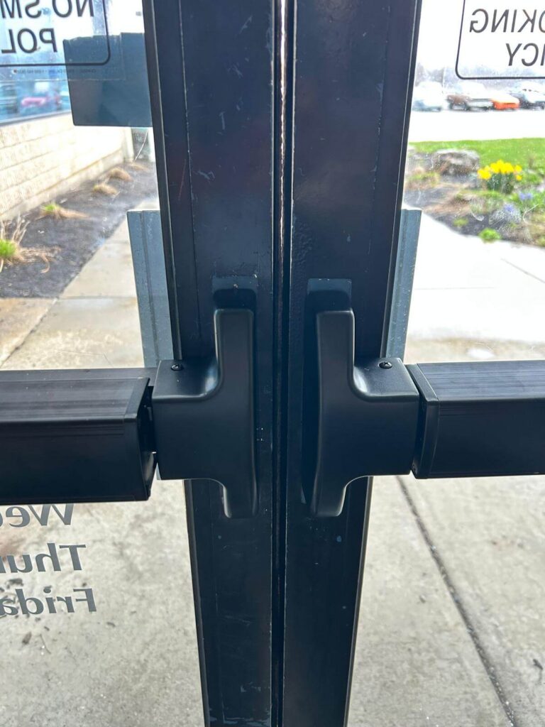 Push-bar exit devices on commercial storefront glass doors in Buffalo, NY