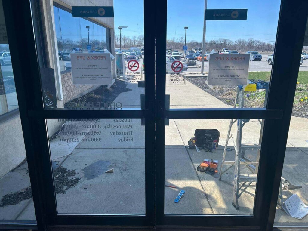 Commercial storefront glass double doors during a locksmith service in Buffalo, NY