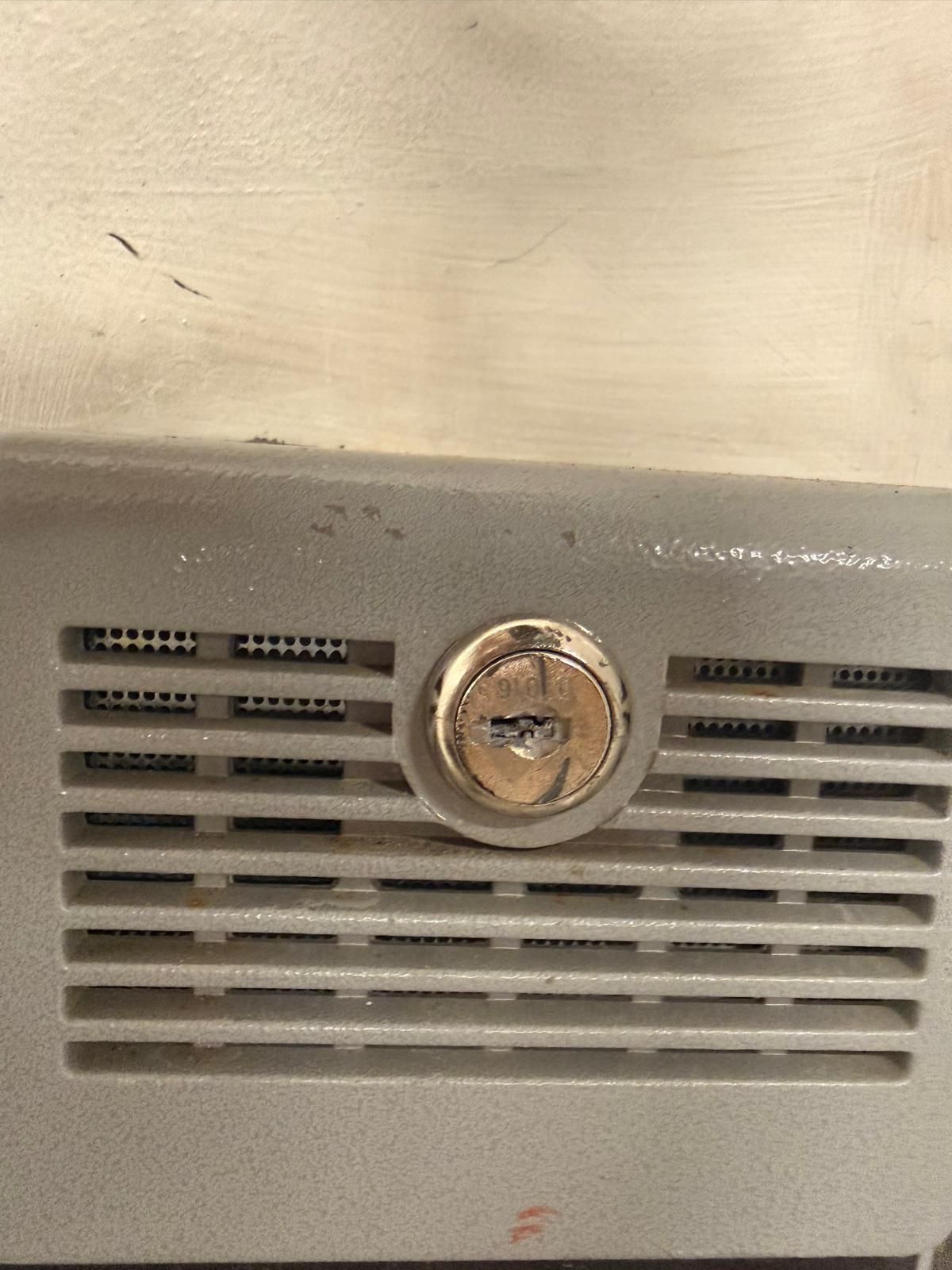 Broken key extraction from a cam lock in Buffalo, NY Brass key snapped off flush inside a metal cabinet cam lock, ready for extraction